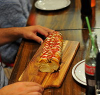 Paesano's Pizzeria with Double Dogs - Mentone